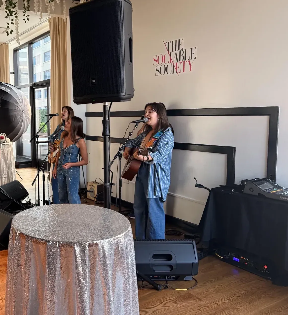 Live music performance with PA system and audience at Nashville indoor venue