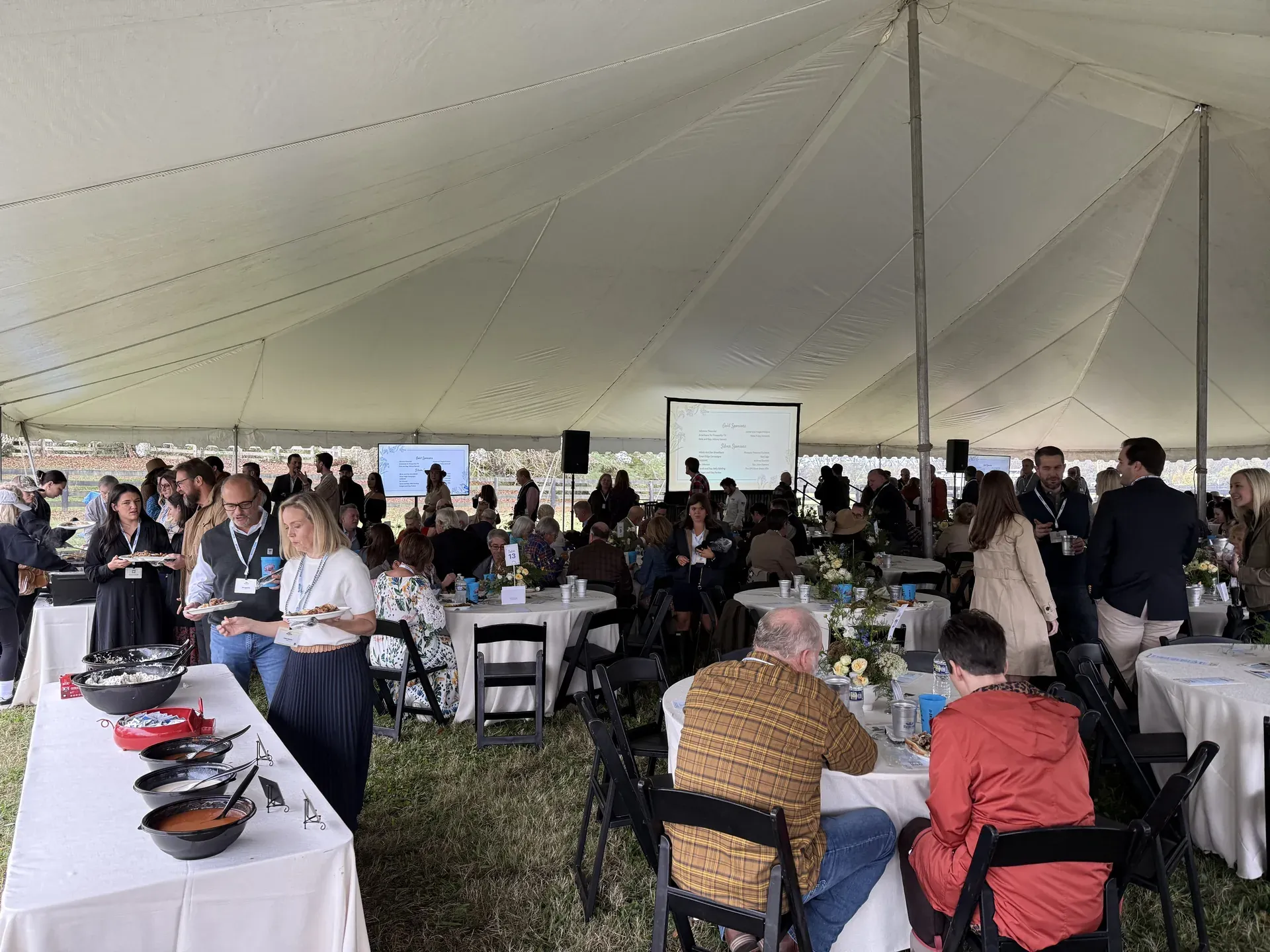 Outdoor dining tent with audio and projection setup