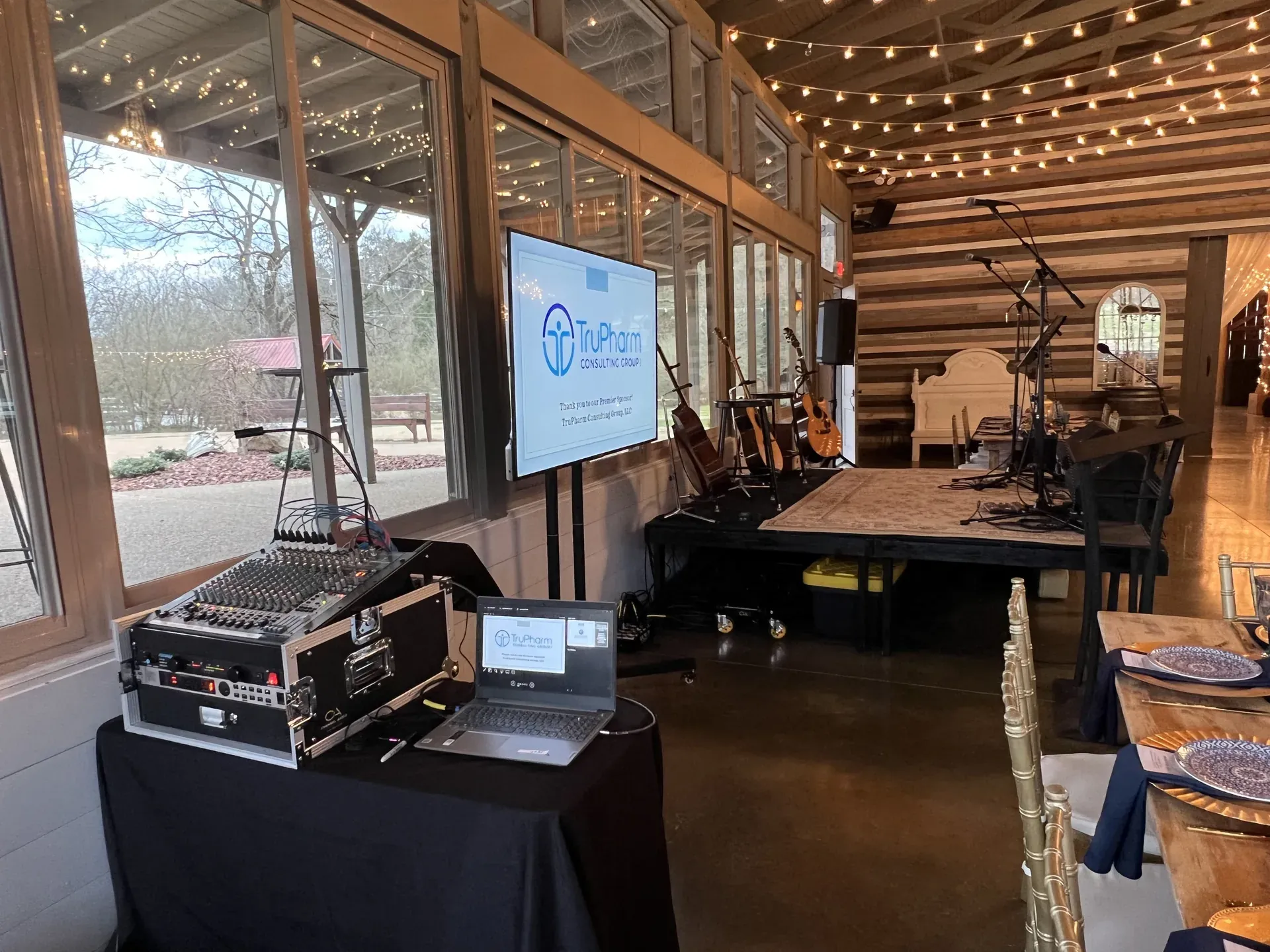 TV and audio setup at a rustic healthcare event