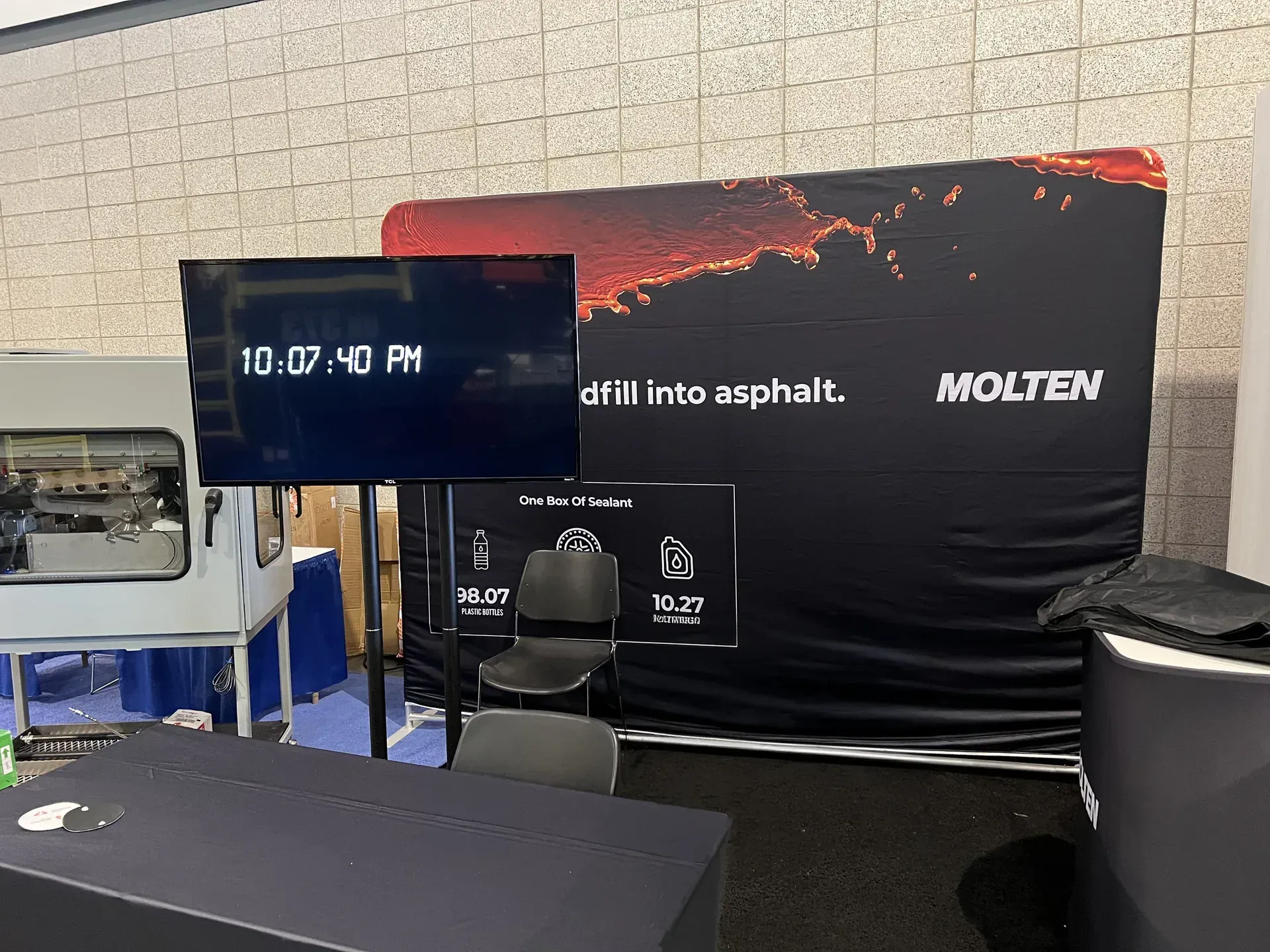 Trade show TV display showing digital clock at Nashville expo