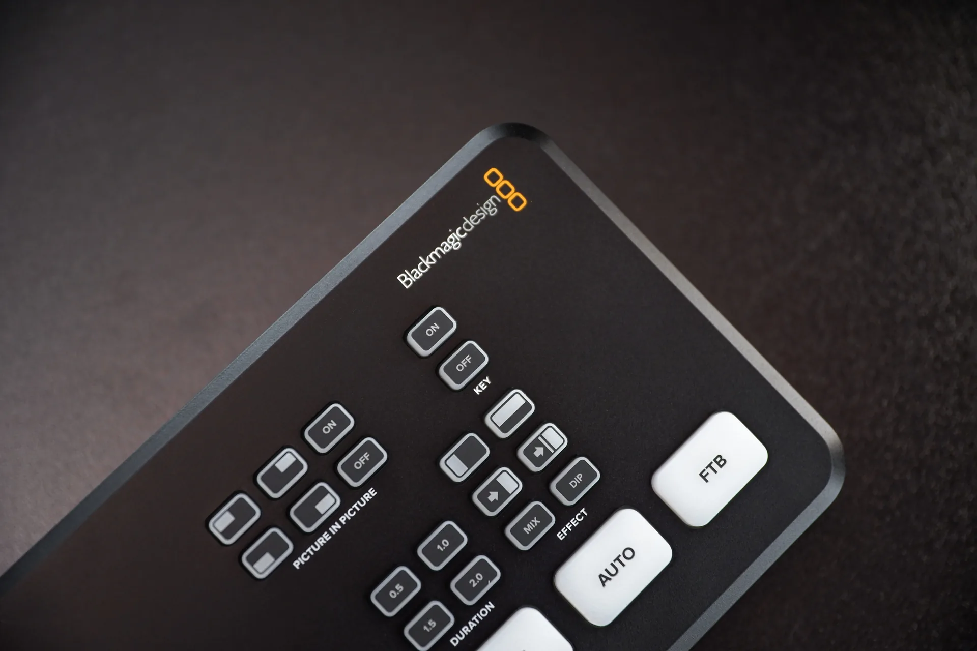 Video switcher control panel with buttons for managing video feeds in live production