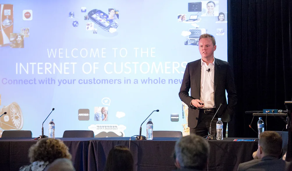 Businessman presenting video content on projector screen to meeting attendees