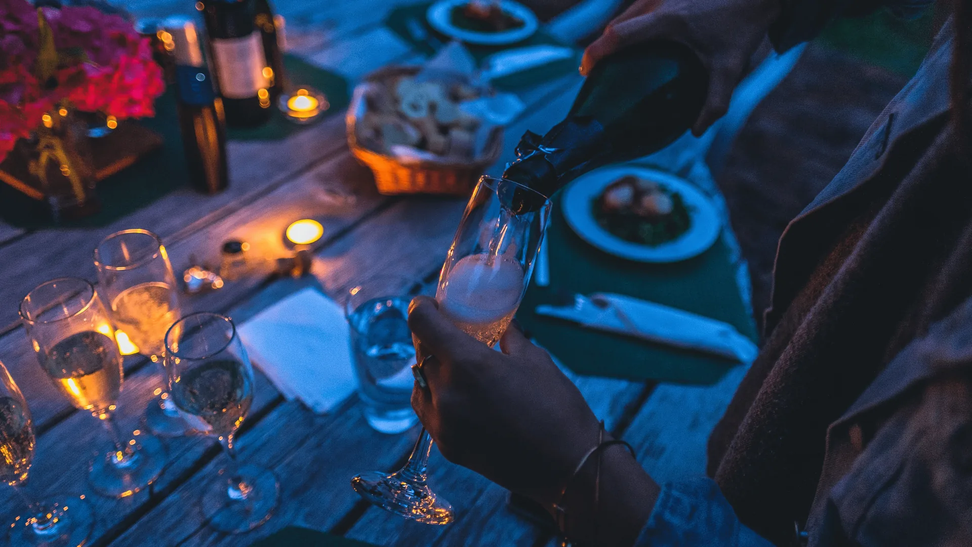 Champagne being poured into a glass at an elegant event celebration