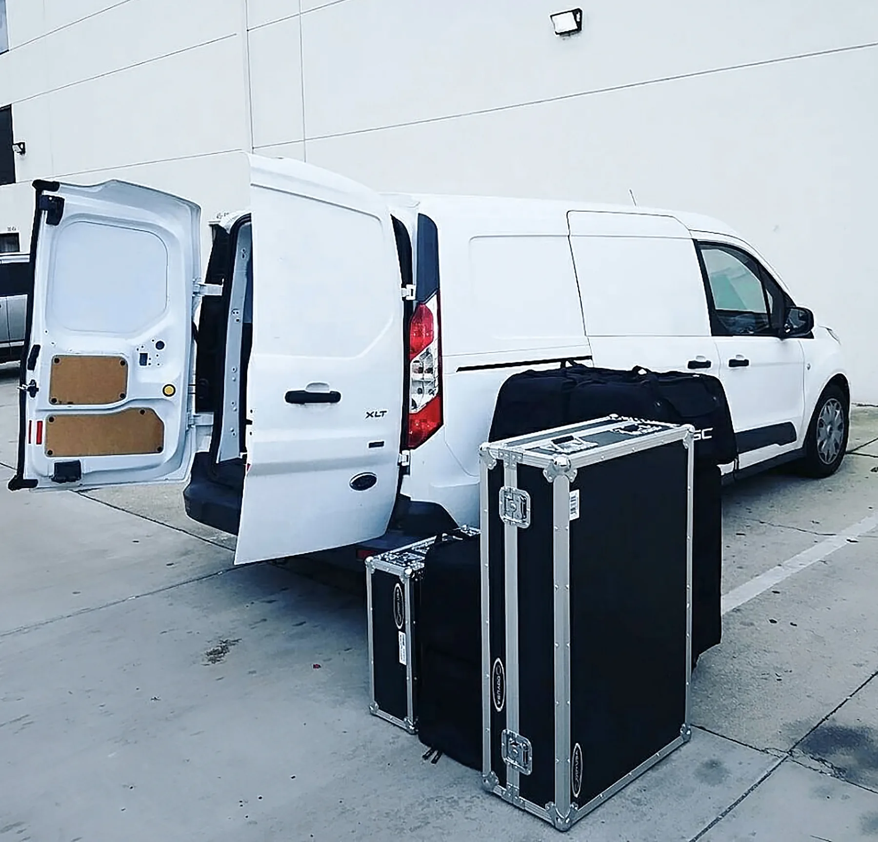 Cargo van loaded with audio equipment for event delivery and setup