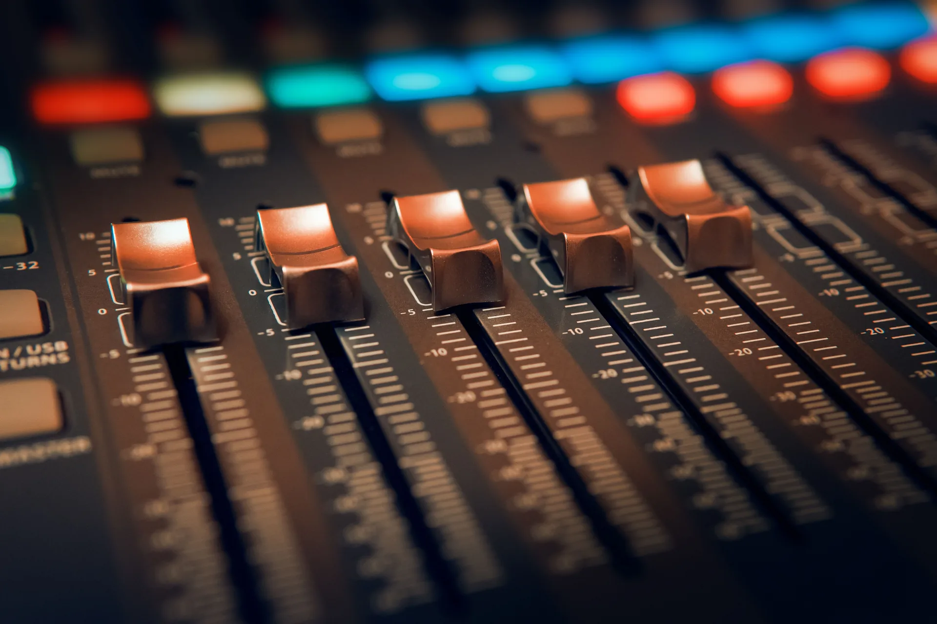 Close up view of faders and controls on professional soundboard