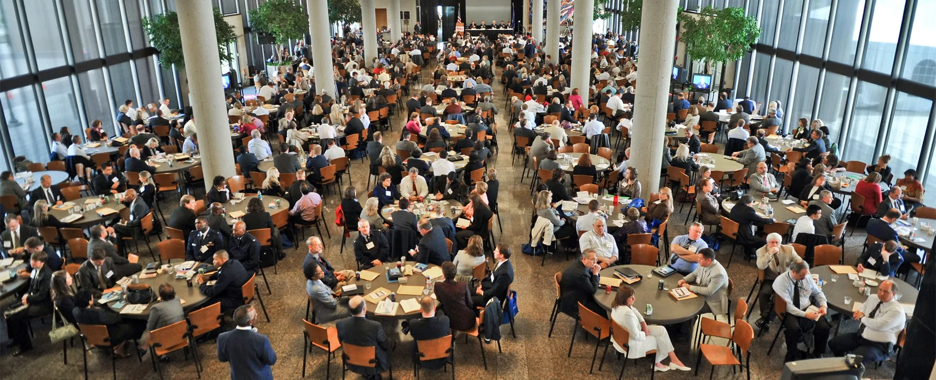 Modern corporate conference venue with rows of seating and professional stage setup