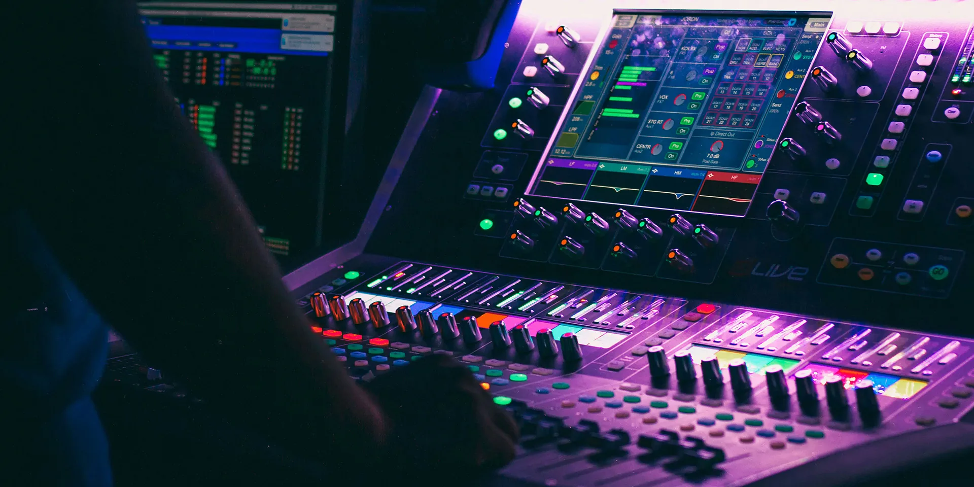 Modern digital audio mixer with touchscreen displaying channel settings and EQ control options