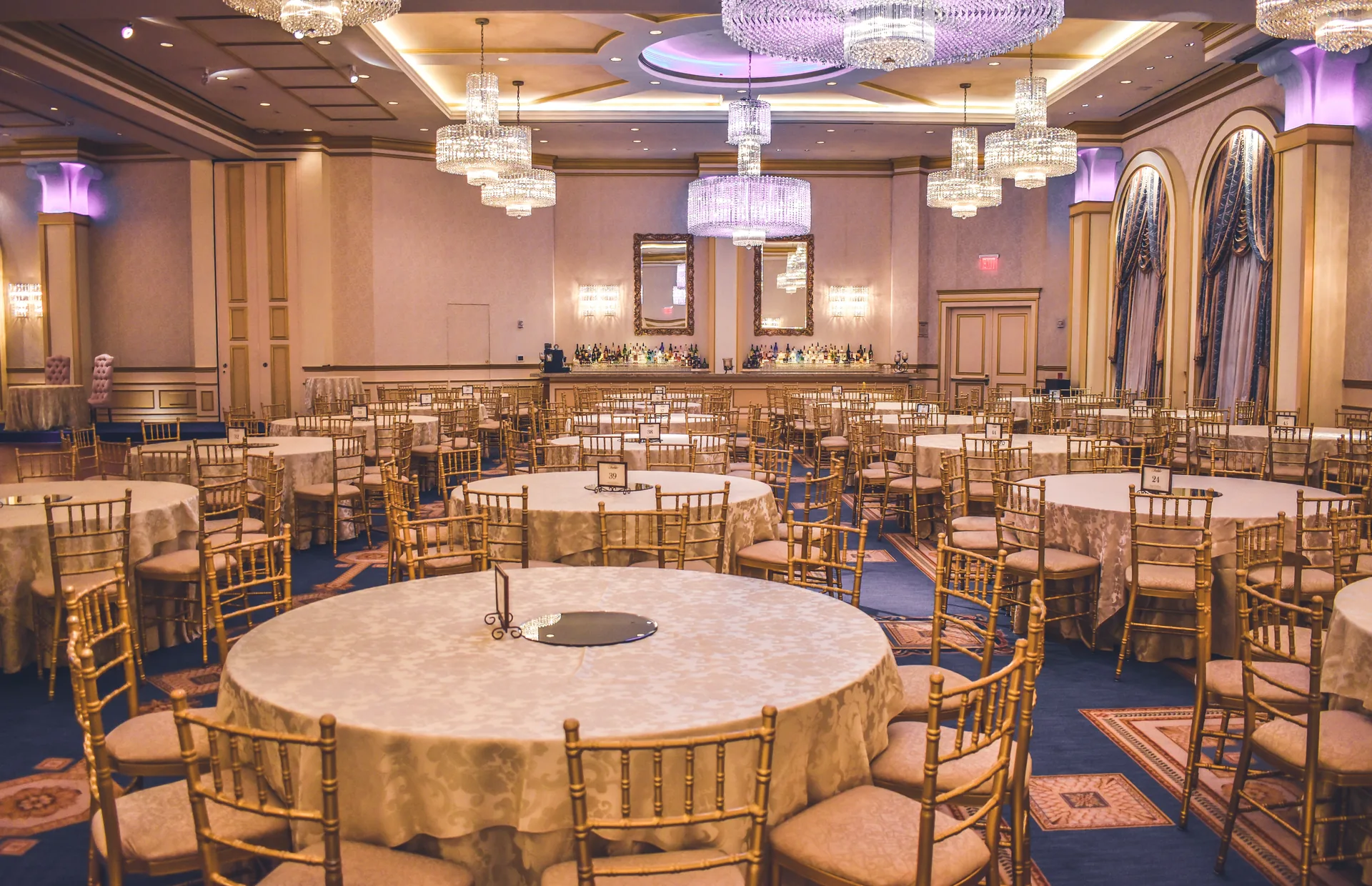 Formal dinner table with place settings, napkins, and glassware arrangement