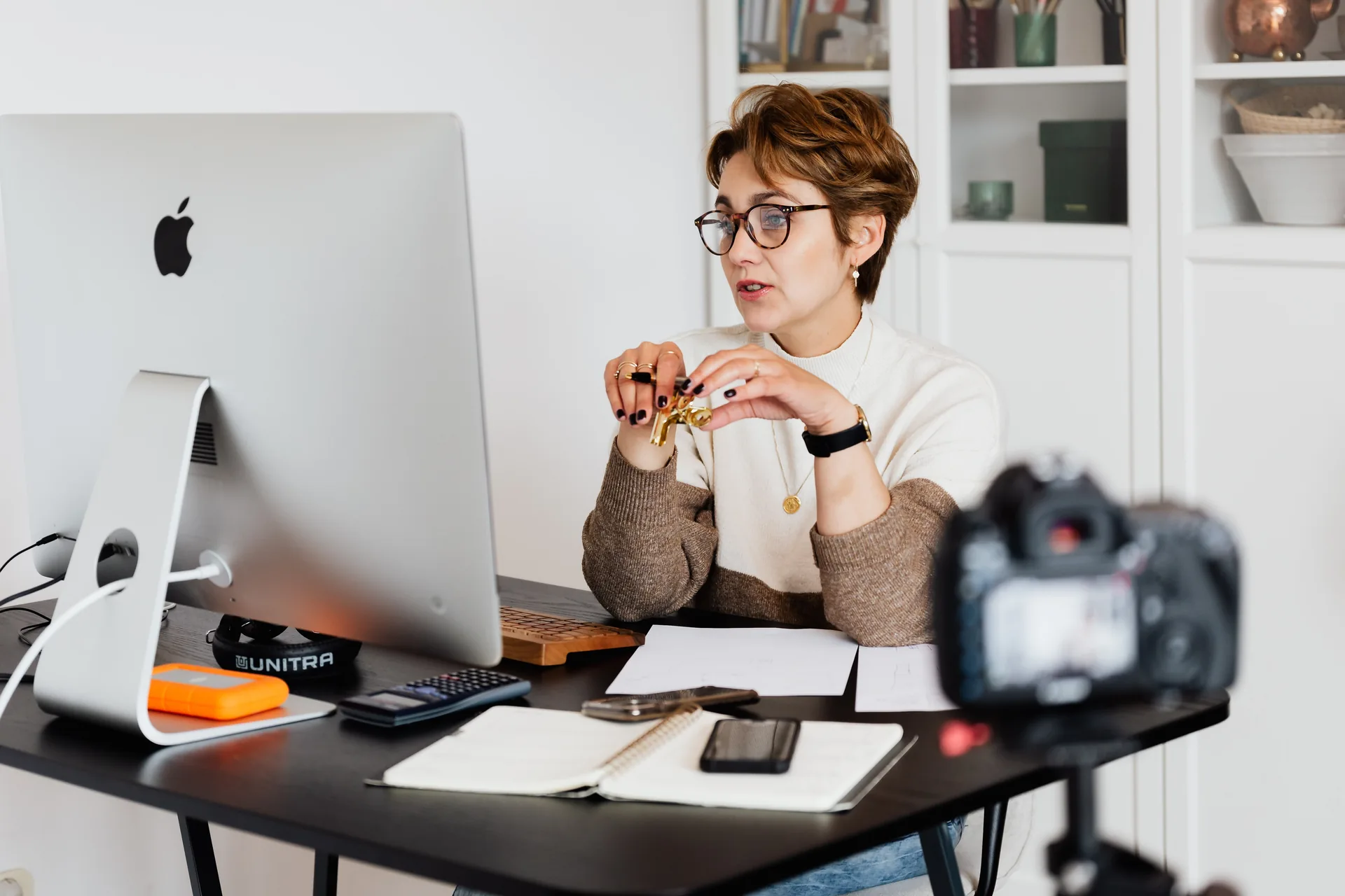 Event planner presenting content on a hybrid event webcast
