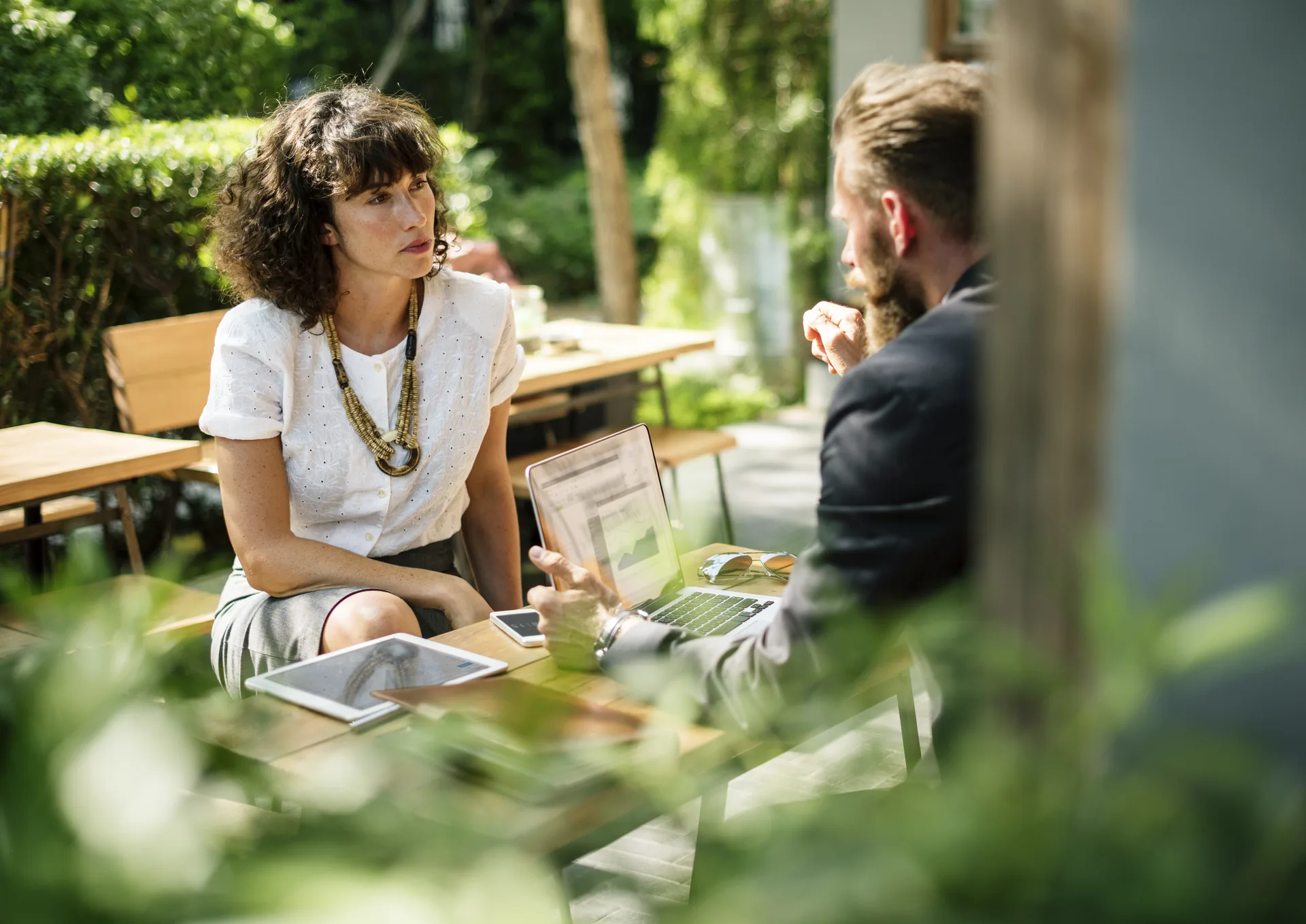 Professional outdoor meeting to discuss AV rental quote and event planning