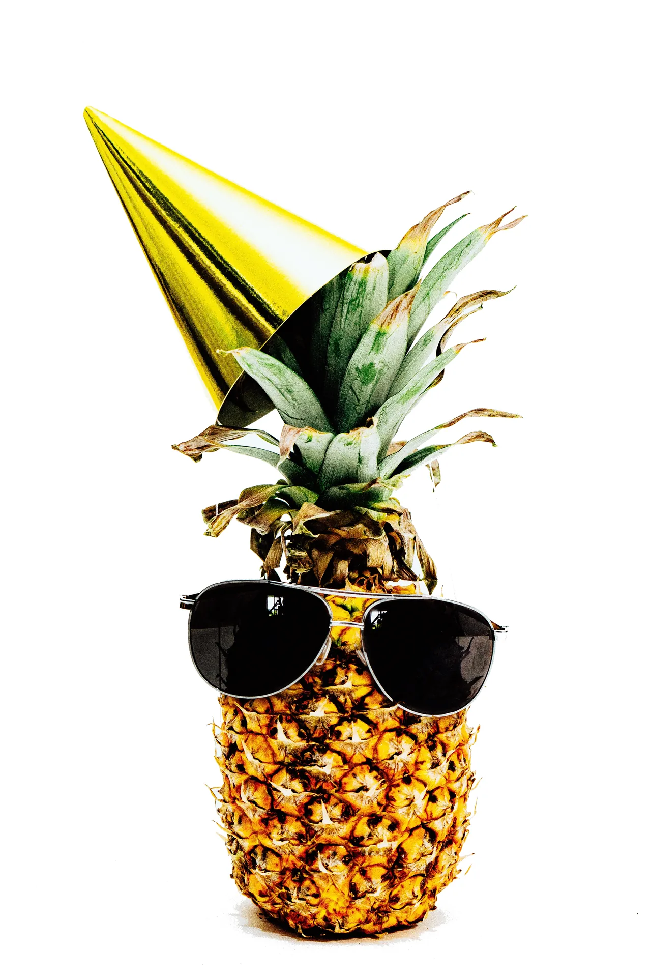 Decorative pineapple wearing sunglasses as fun party themed decoration