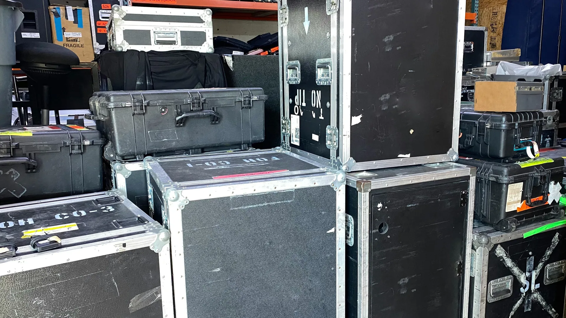 Multiple heavy-duty road cases stacked for secure AV equipment storage and transport