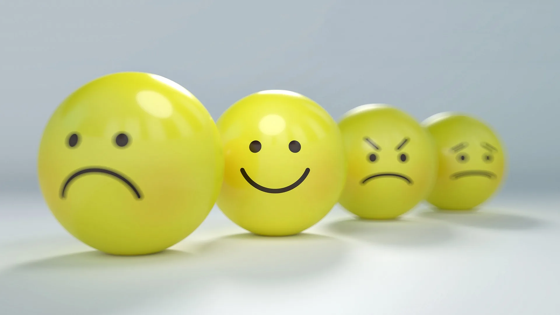 Smiley face expressions representing different emotions and audience reactions
