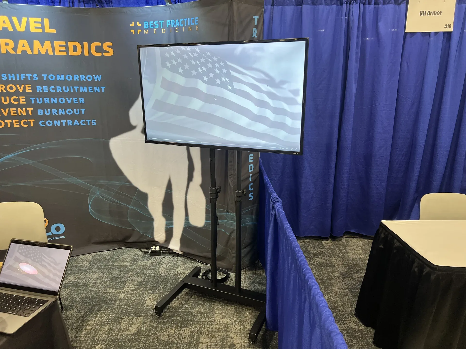 Trade show booth TV display showing an American flag graphic