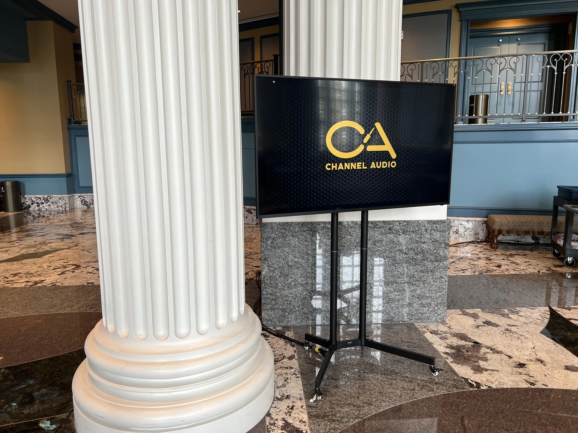 Corporate trade show booth with digital displays and modern setup