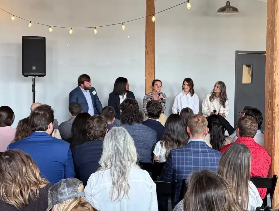 Panel discussion with audience seating and PA audio support at a Nashville event