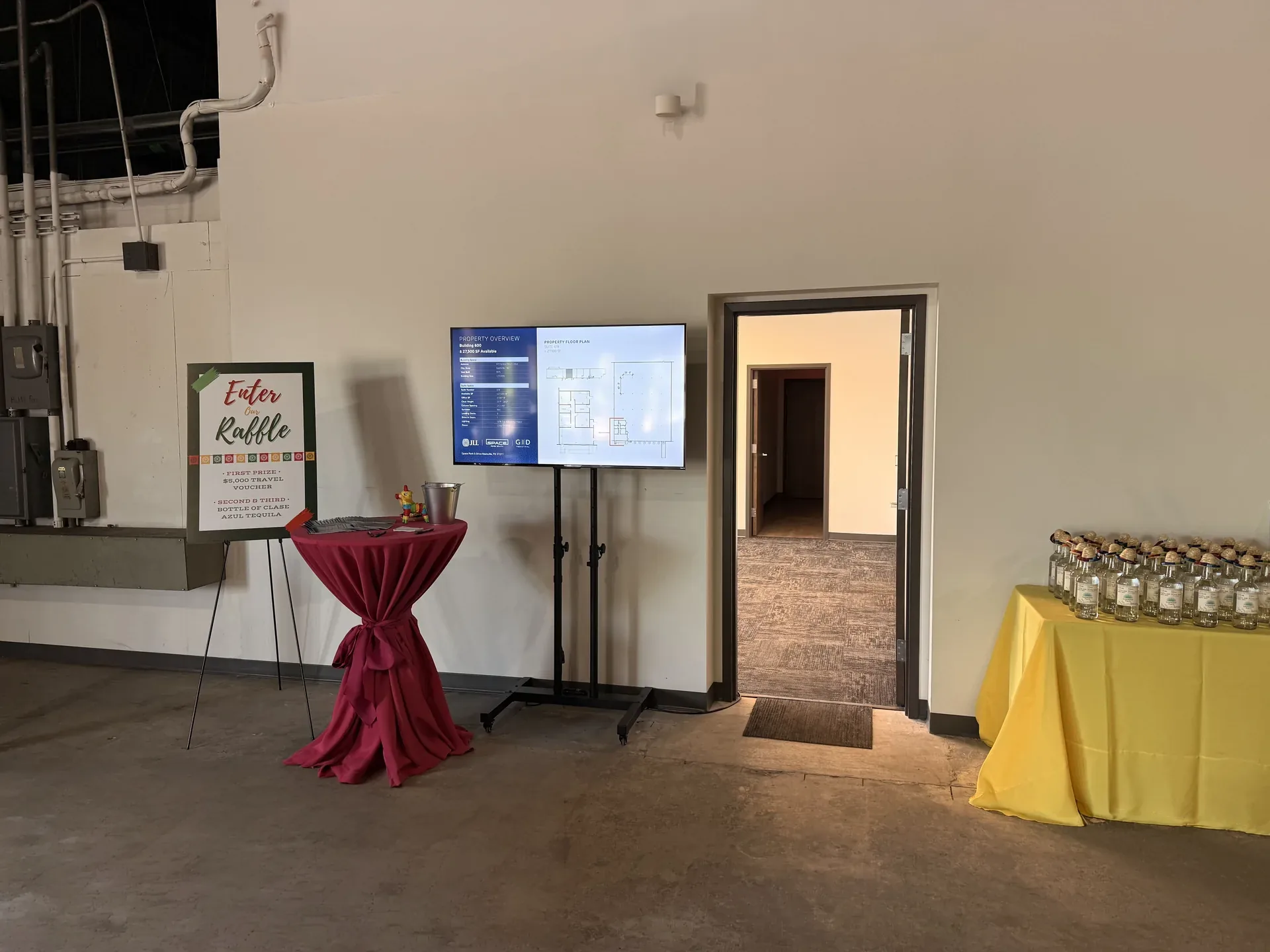 TV screen and event signage for raffle setup at Nashville indoor venue