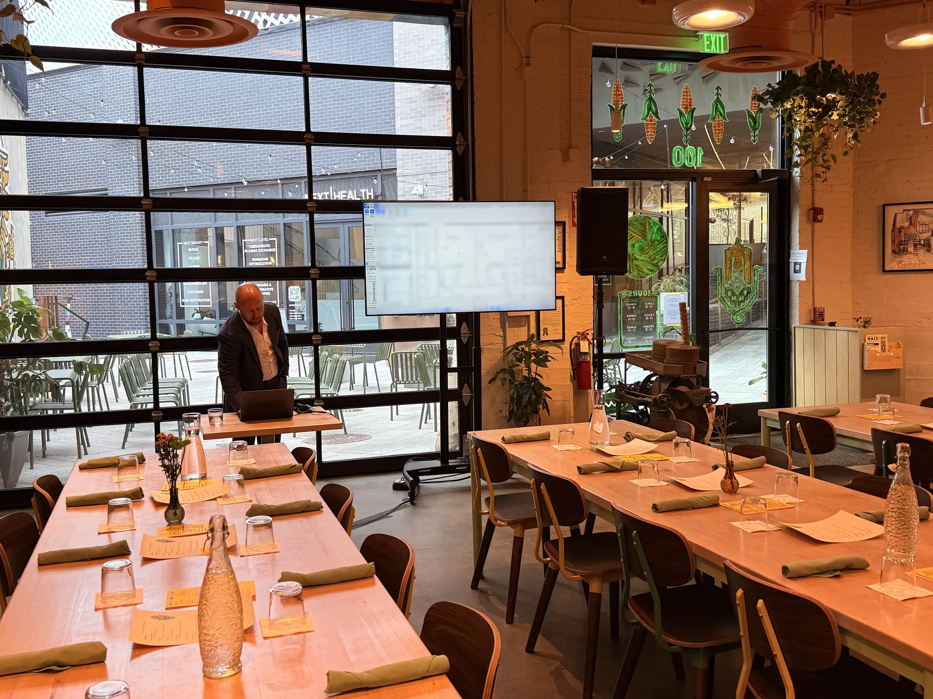 AV setup for a business presentation in a modern Nashville restaurant with a TV display and sound system